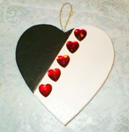 Hand decorated paper mache Valentine ornament.
